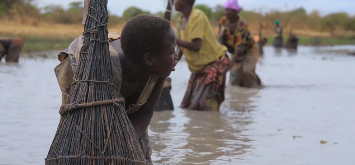 Oupei women express determination to protect the Komirya wetland.